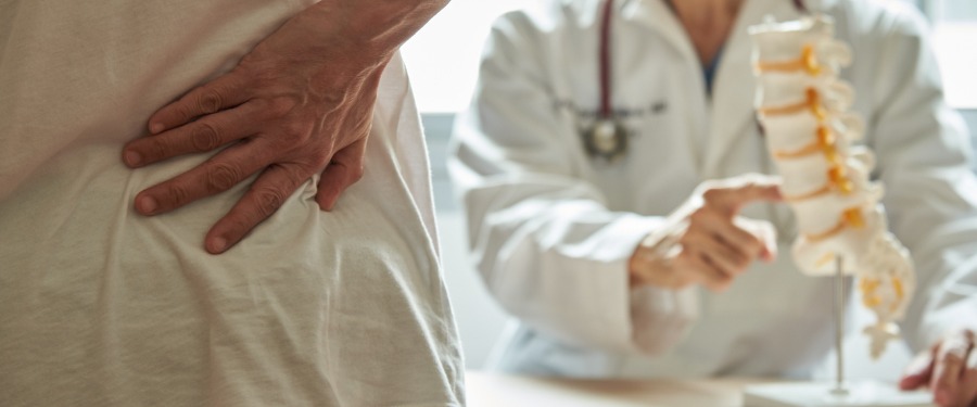 Doctor talking to patient about osteoporosis Doctor talking to patient about osteoporosis