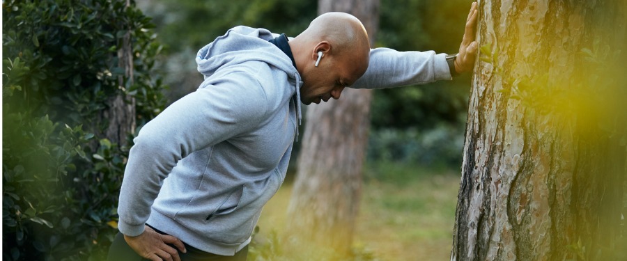 Black man struggling with asthma attack while jogging Black man struggling with asthma attack while jogging