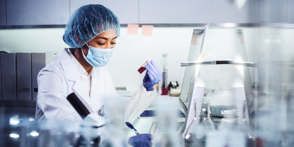 Young female doctor working in a lab Young female doctor working in a lab