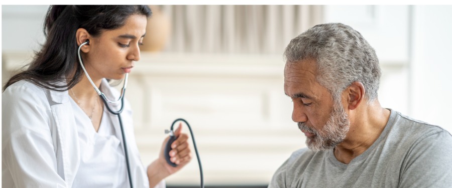 Resistant hypertension patient receiving blood pressure check Resistant hypertension patient receiving blood pressure check