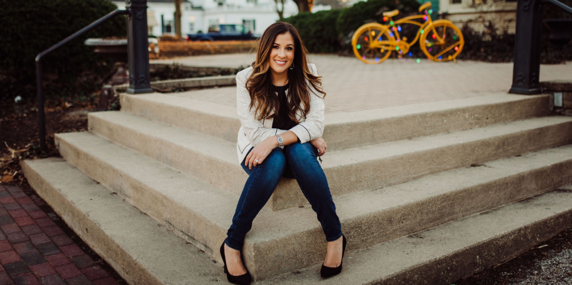 Courtney Wulf sitting on steps outside