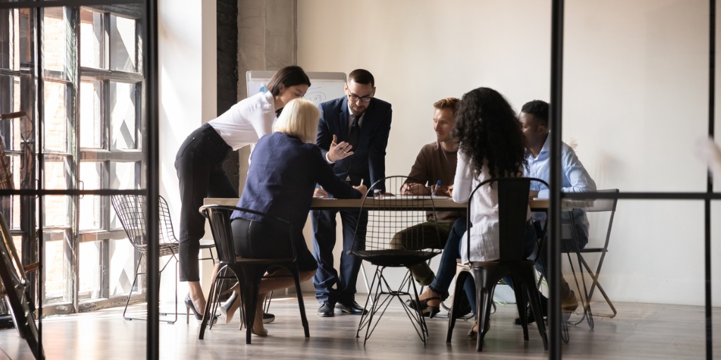 Employees team engaged in teamwork in modern office