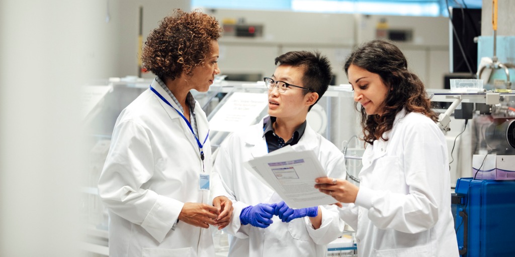 Scientists discussing a clinical trial protocol