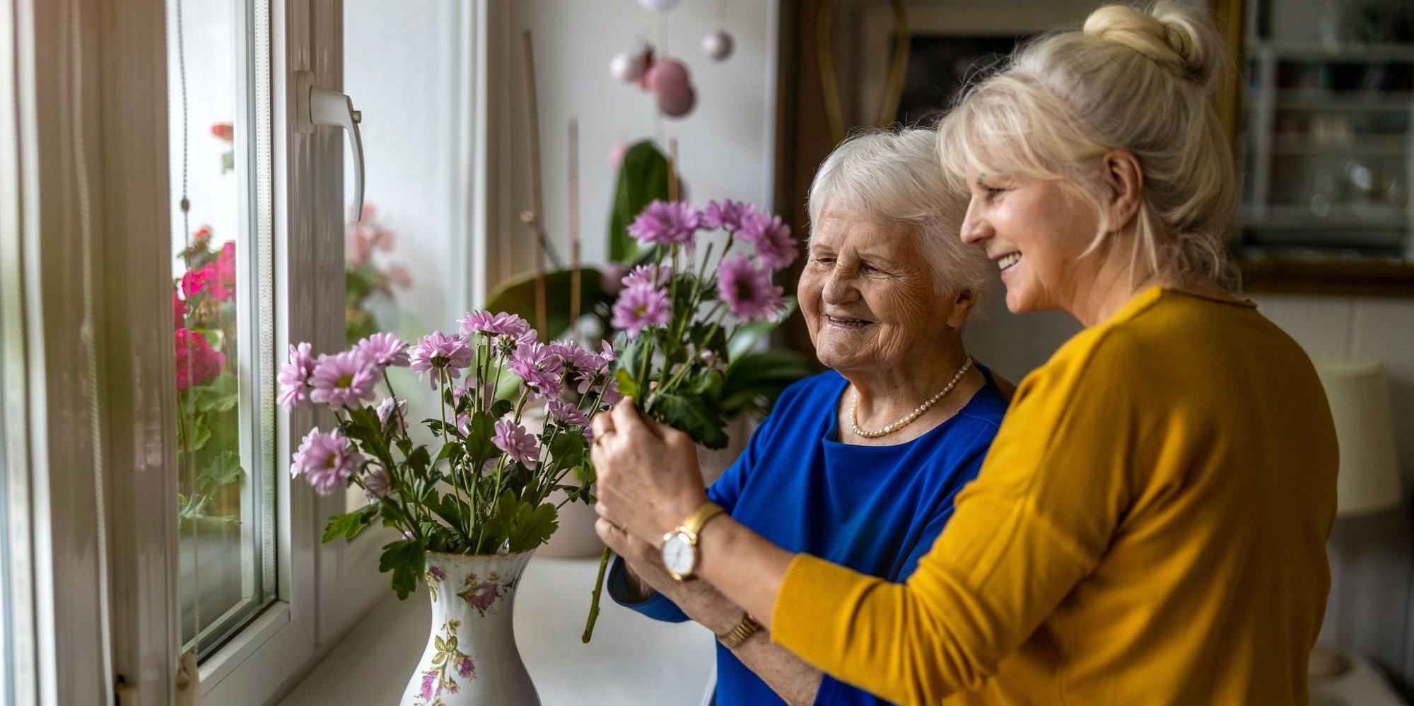 Daughter assisting mother with Alzheimer’s disease
