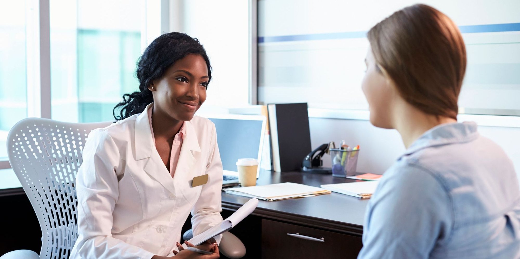 Woman discussing endometrial cancer with doctor