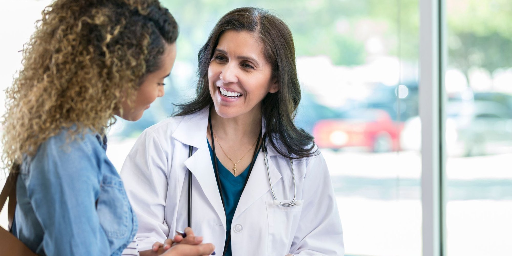 woman discussing clinical trial design with patient