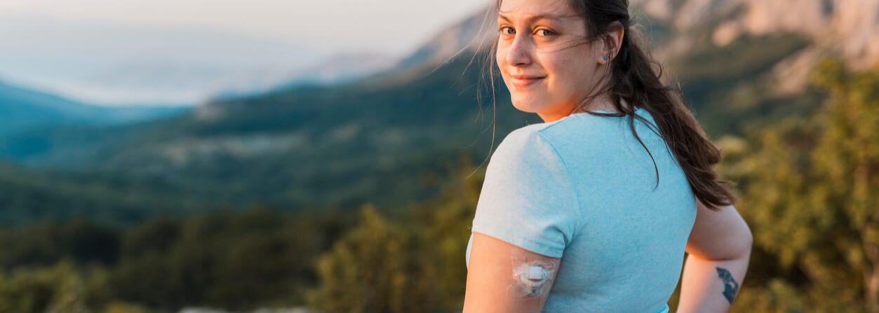 Woman with type 1 diabetes on a hike. Woman with type 1 diabetes on a hike.