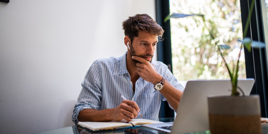 Young man working from home.