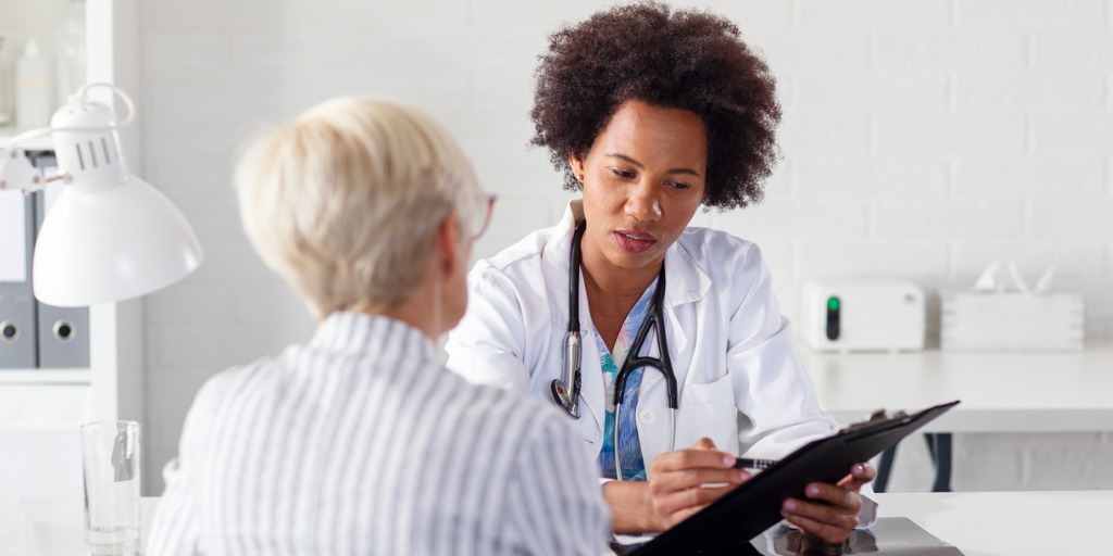 Mature woman at the doctor office come to consult about her health