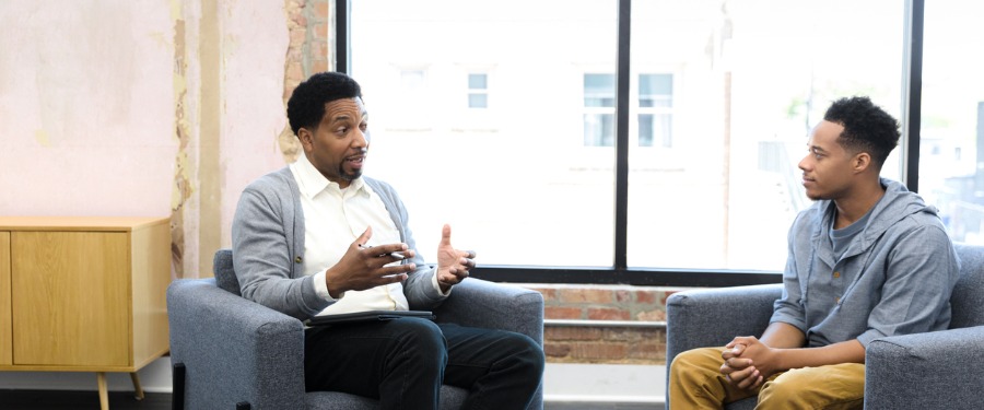 Two Black men in a therapy session Two Black men in a therapy session