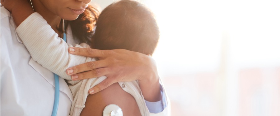 Newborn child getting exam for homocystinuria Newborn child getting exam for homocystinuria