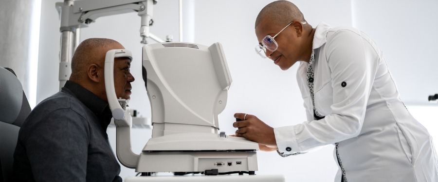 Black male getting an eye exam for National Glaucoma Awareness Month