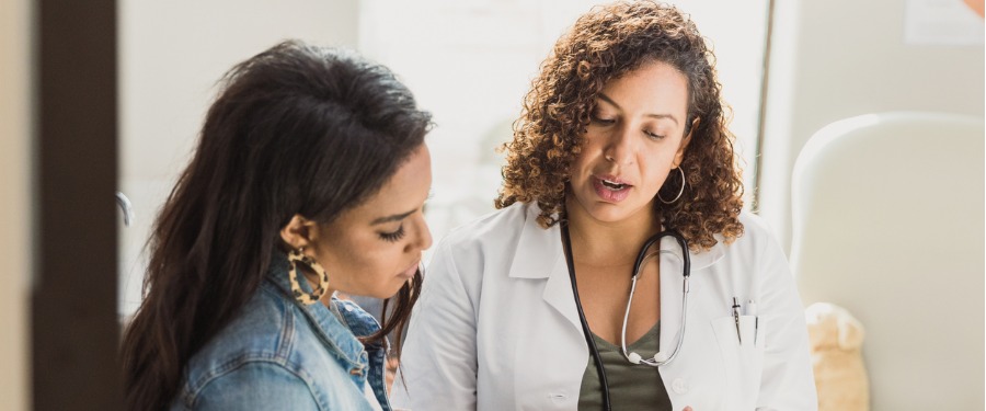 Woman discussing chronic kidney disease clinical trials with doctor Woman discussing chronic kidney disease clinical trials with doctor