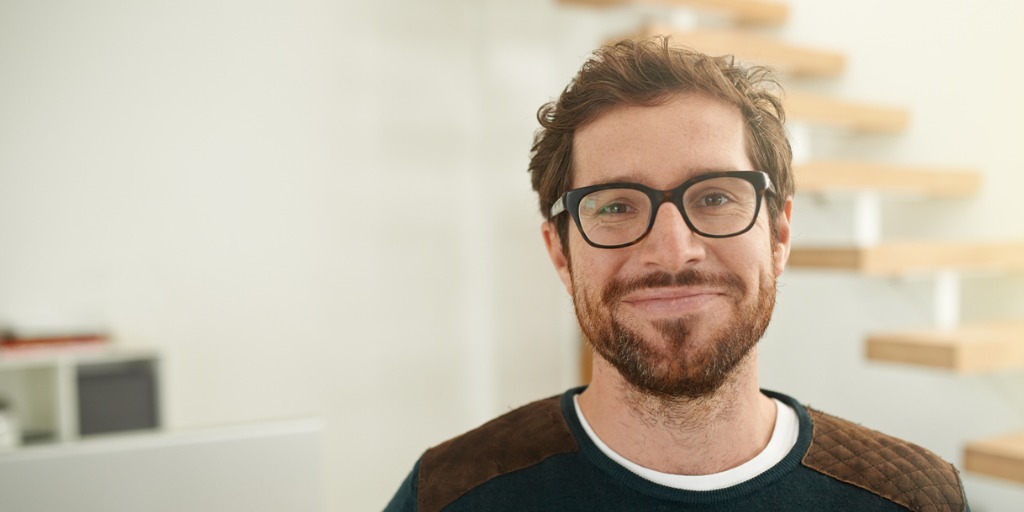 Portrait of a confident young entrepreneur standing in his office