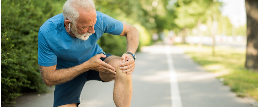 Older man experiencing symptoms of knee osteoarthritis Older man experiencing symptoms of knee osteoarthritis