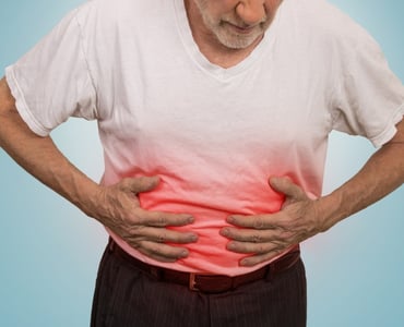 stomach-ache-man-placing-hands-on-the-abdomen-picture-id483922362