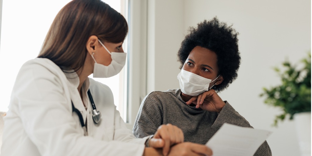 Doctor speaking with patient about a clinical trial