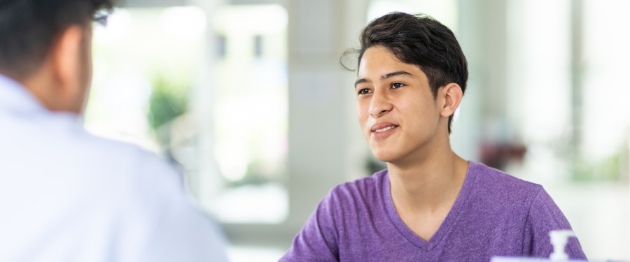 Boy discussing Hunter’s disease with his doctor