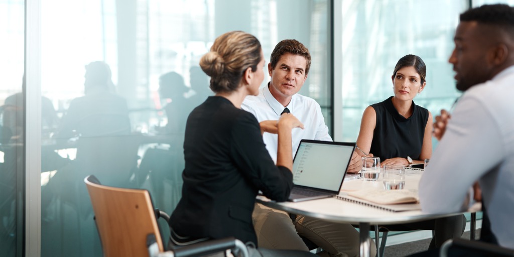 Shot of a group of businesspeople having a meeting in a modern office.