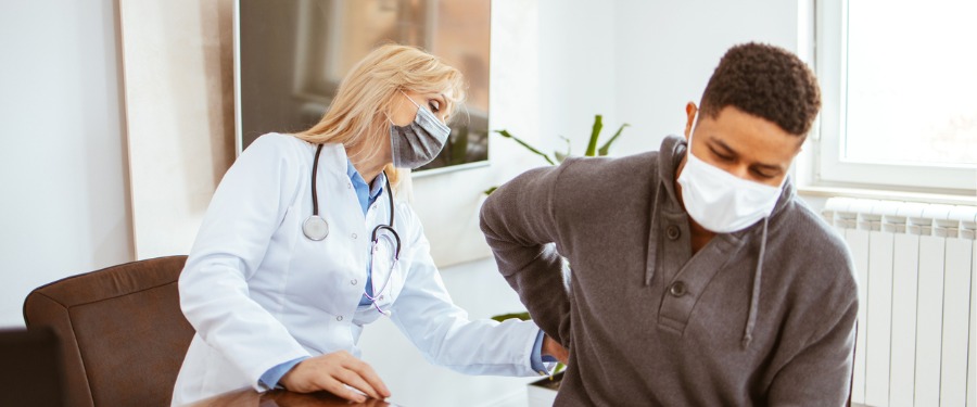 Young man talking to doctor about chronic kidney disease