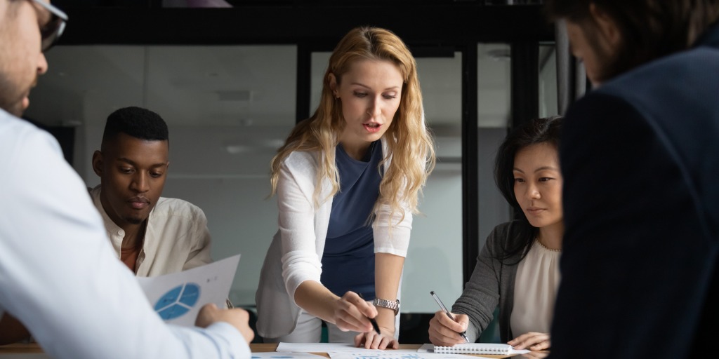 Focused group of diverse employees holding brainstorming meeting, discussing project ideas. Focused group of diverse employees holding brainstorming meeting, discussing project ideas.