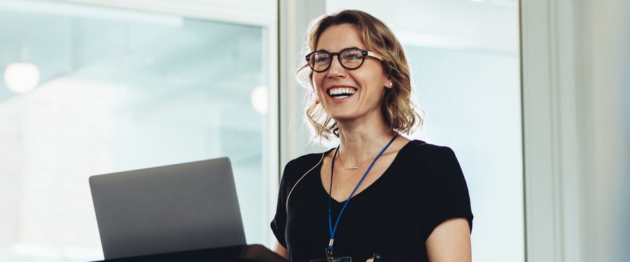 Woman presenting on clinical trial recruitment in 2023