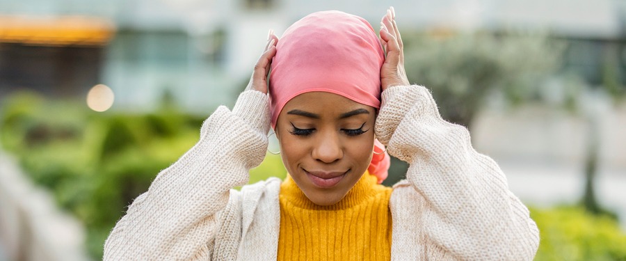 Breast cancer patient in pink headscarf