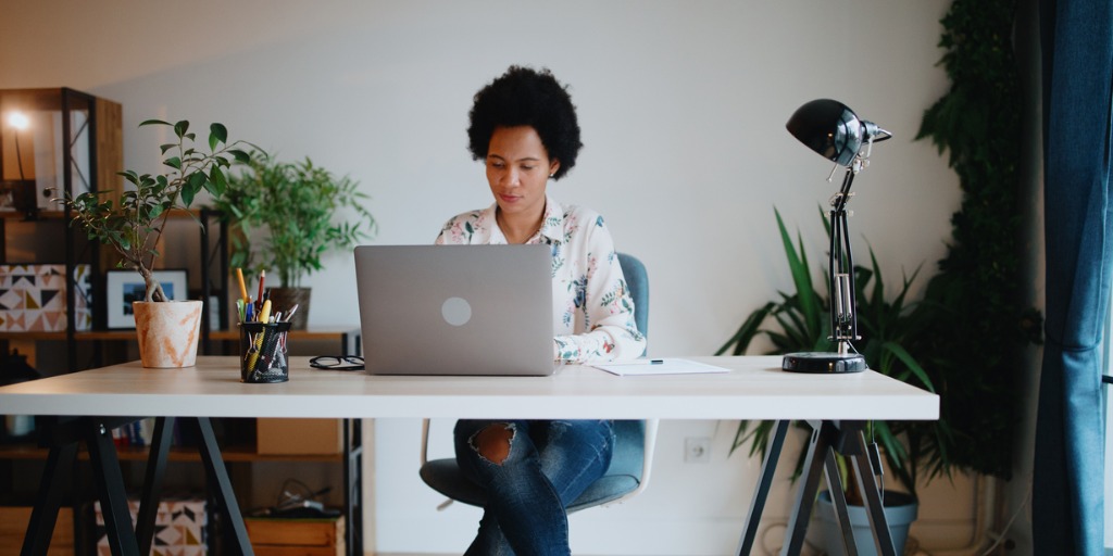 Young professional woman working from home office.